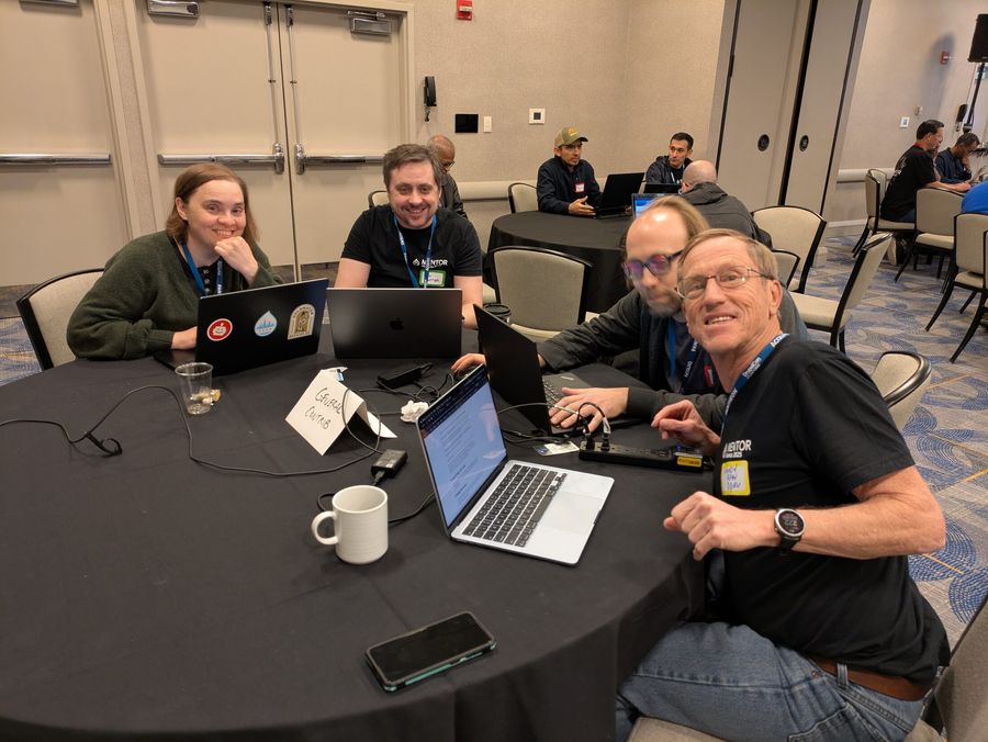 Randy at table doing first-time contributor mentoring.
